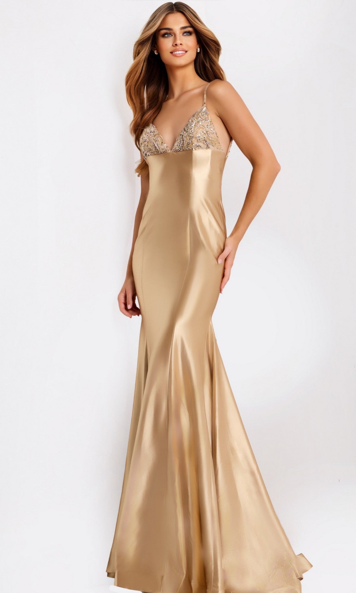 Woman wearing the Jovani 48733 long prom dress in sand, featuring a fitted bodice and mermaid silhouette, standing against a plain white background.